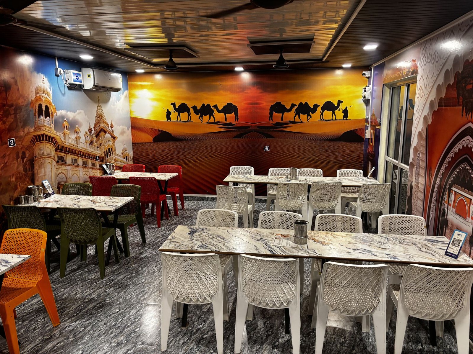 Main dining hall at Seth Sawariya Hotel and Restaurant with desert mural